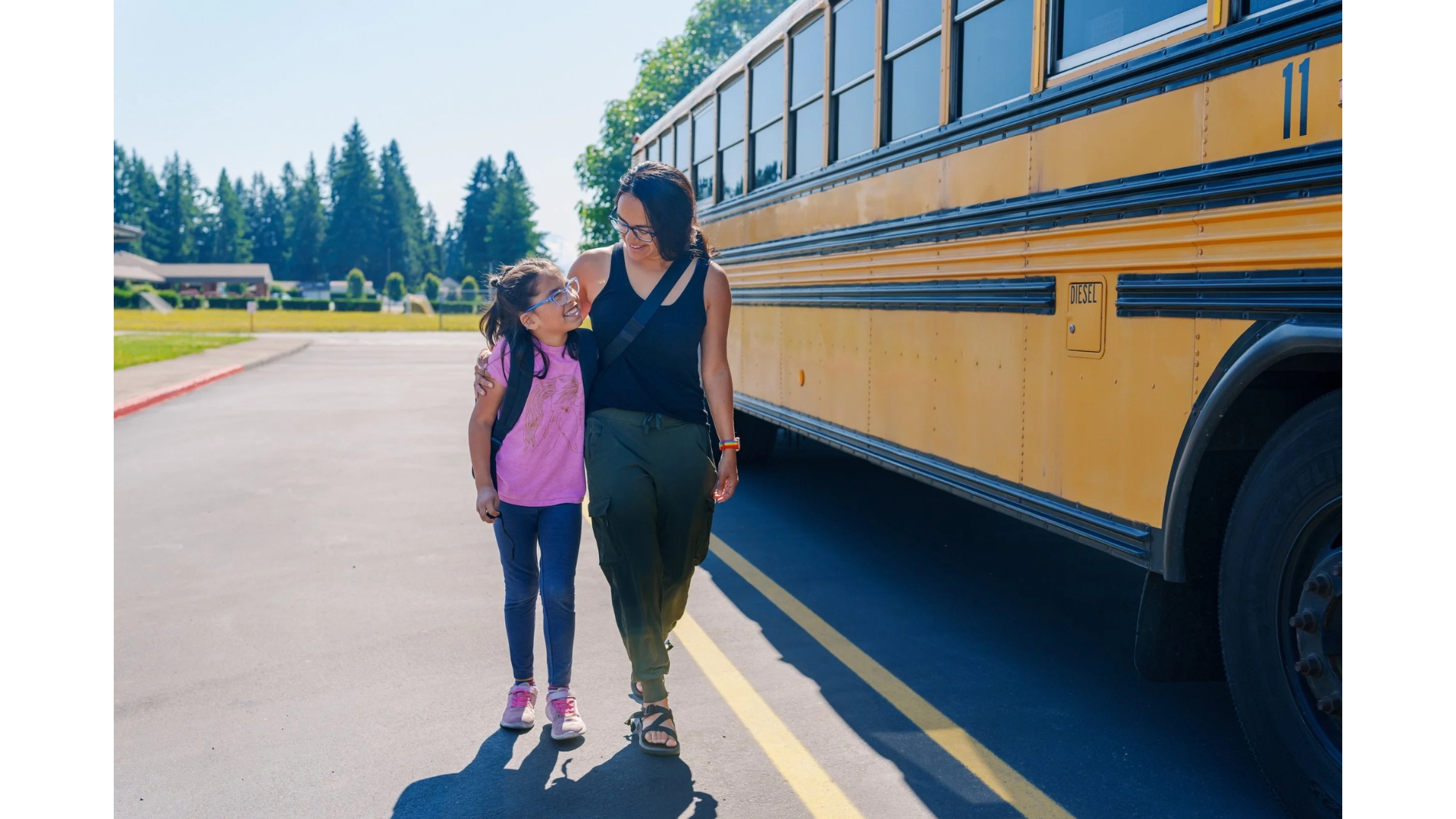 A Charlotte mother and daughter walking together near their school